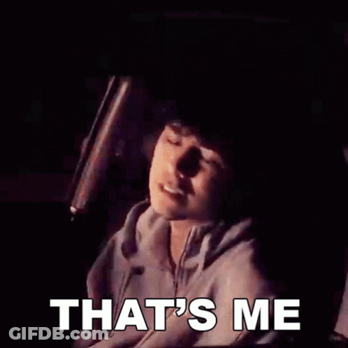 A Man Is Holding A Bat And The Words That 'S Me Are On The Screen GIF