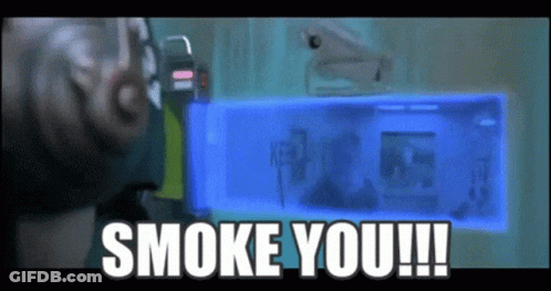 A Man Is Holding A Blue Box That Says " Smoke You " GIF