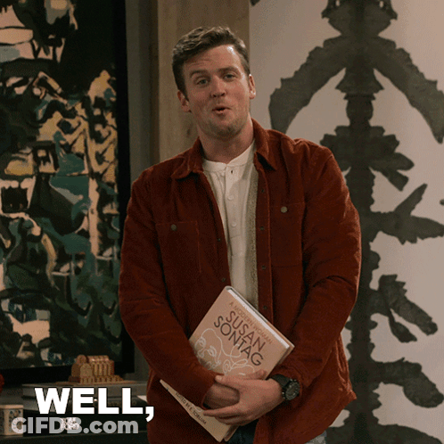 A Man Is Holding A Book By Susan Sontag And Says " Well " GIF