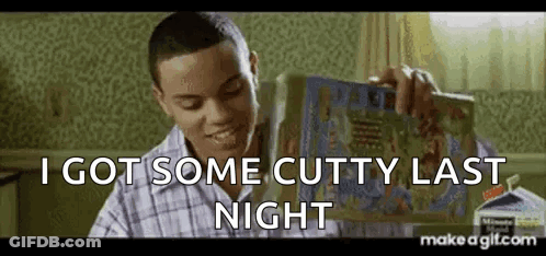 A Man Is Holding A Book In His Hand And Saying `` I Got Some Cutty Last Night '' . GIF