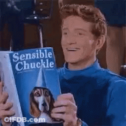 A Man Is Holding A Book Titled Sensible Chuckle . GIF