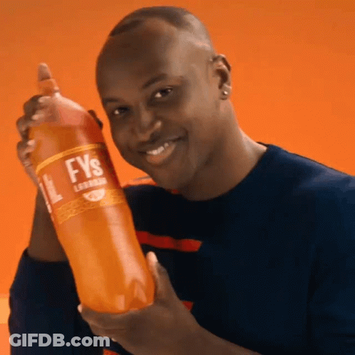 A Man Is Holding A Bottle Of Fys GIF