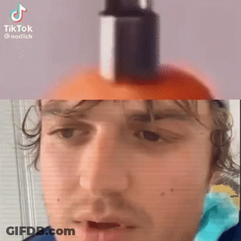 A Man Is Holding A Bottle Of Lotion On His Head . GIF