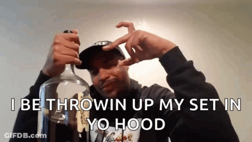 A Man Is Holding A Bottle With The Words " I Be Throwin Up My Set In Yo Hood " Above Him GIF
