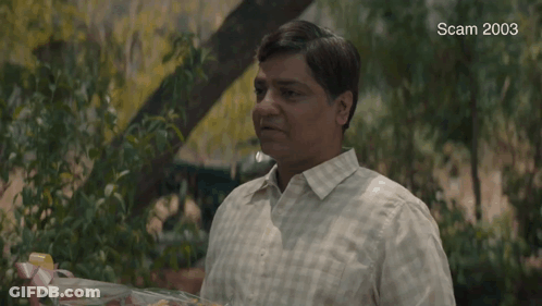 A Man Is Holding A Bouquet Of Flowers And The Words Congratulations Are On The Screen GIF