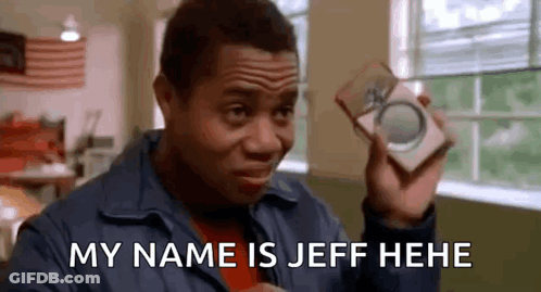 A Man Is Holding A Box In His Hand And Saying `` My Name Is Jeff He He '' . GIF