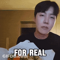 A Man Is Holding A Box Of Food With The Words For Real Written On It GIF