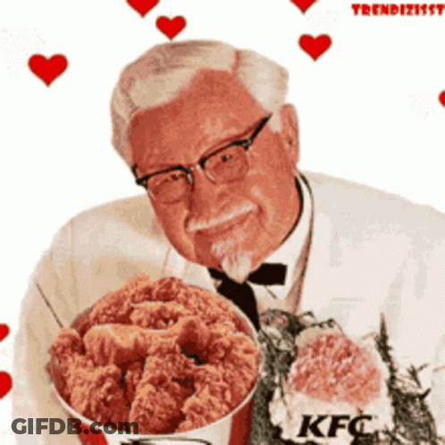A Man Is Holding A Bucket Of Fried Chicken With Kfc Written On It GIF