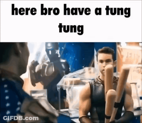 A Man Is Holding A Bunch Of Baseball Bats And Talking To Another Man . GIF