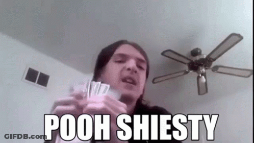 A Man Is Holding A Bunch Of Money And A Ceiling Fan In His Hands . GIF