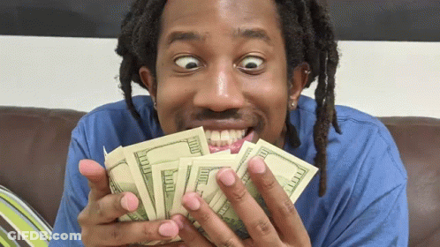 A Man Is Holding A Bunch Of Money In His Hands GIF