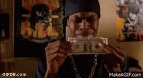 A Man Is Holding A Bunch Of Money In His Hands . GIF