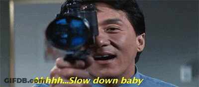 A Man Is Holding A Camera In Front Of His Face And Saying Slow Down Baby . GIF