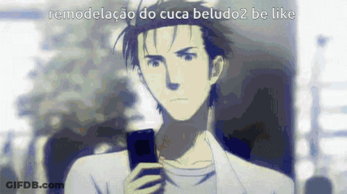A Man Is Holding A Cell Phone In His Hand While Looking At It . GIF