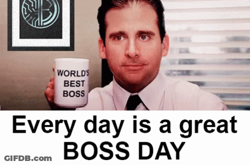 A Man Is Holding A Coffee Mug That Says World 'S Best Boss GIF