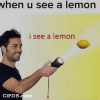A Man Is Holding A Flashlight And A Lemon Is Flying In The Air Behind Him . GIF