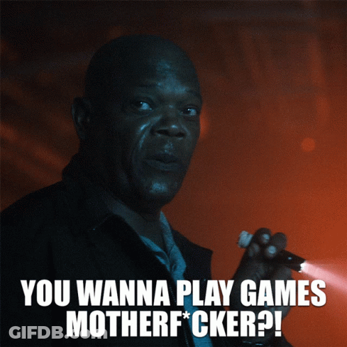 A Man Is Holding A Flashlight And Says " You Wanna Play Games Motherf*cker " GIF