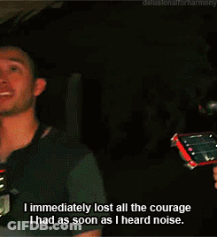 A Man Is Holding A Flashlight In Front Of A Tree And Says I Immediately Lost All The Courage GIF