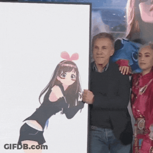 A Man Is Holding A Framed Picture Of A Girl With A Bow On Her Head GIF