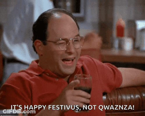 A Man Is Holding A Glass Of Wine And Says It 'S Happy Festivus Not Qwaznza GIF