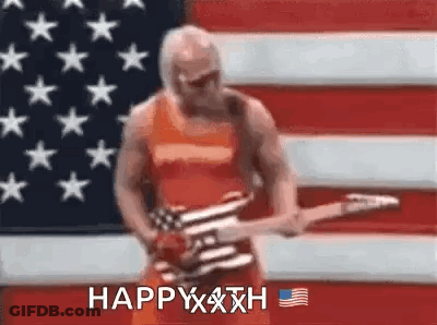 A Man Is Holding A Guitar In Front Of An American Flag . GIF