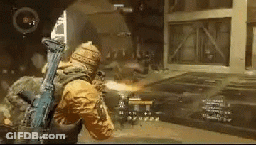 A Man Is Holding A Gun In A Video Game And Shooting A Bullet . GIF