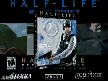 A Man Is Holding A Gun In Front Of A Screen That Says Half-Life GIF