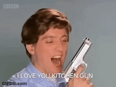 A Man Is Holding A Gun In His Hand And Screaming . GIF