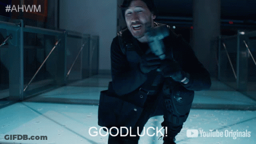 A Man Is Holding A Hammer And Says Goodluck GIF