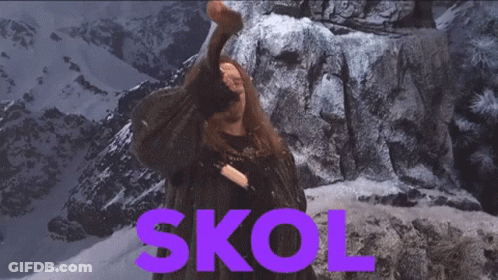 A Man Is Holding A Hammer In Front Of A Mountain And The Word Skol Is In Purple GIF