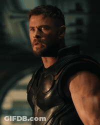A Man Is Holding A Hammer In His Right Hand GIF