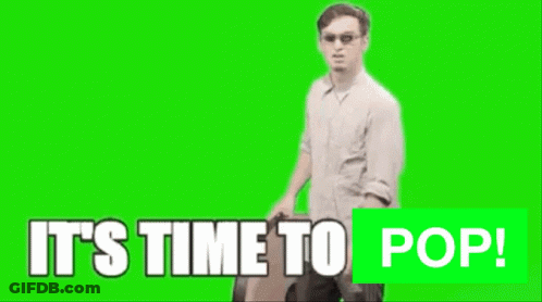 A Man Is Holding A Large Clock With The Words It 'S Time To Pop GIF