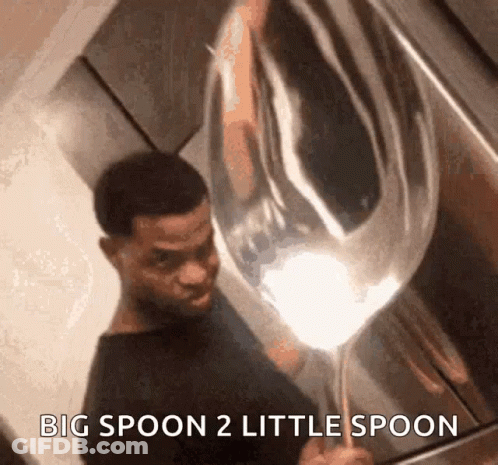 A Man Is Holding A Large Spoon With The Words Big Spoon 2 Little Spoon Below Him GIF