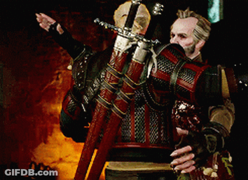 A Man Is Holding A Large Sword In His Hands GIF