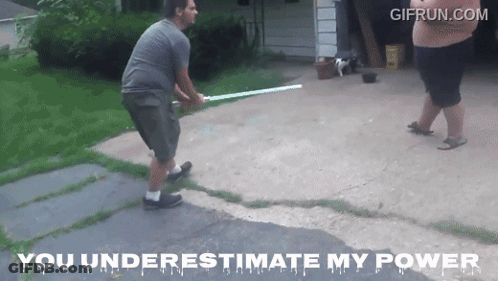 A Man Is Holding A Light Saber While Another Man Stands Behind Him With The Words You Underestimate My Power Below Him GIF