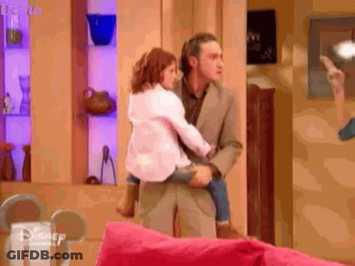 Man Holding Little Girl With Disney Logo GIF