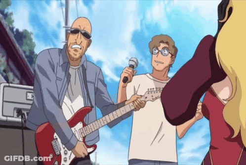 A Man Is Holding A Microphone And Playing A Guitar GIF