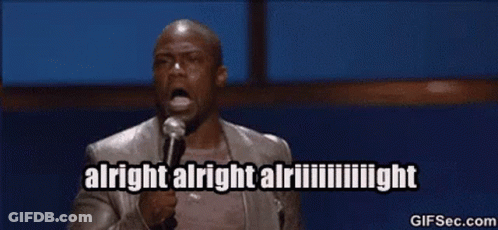 A Man Is Holding A Microphone And Saying Alright Alright Alright GIF