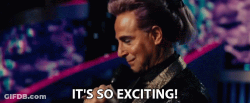 A Man Is Holding A Microphone And Saying It 'S So Exciting . GIF