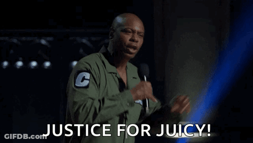 A Man Is Holding A Microphone And Says Justice For Juicy . GIF