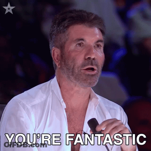 A Man Is Holding A Microphone And Says You 'Re Fantastic GIF