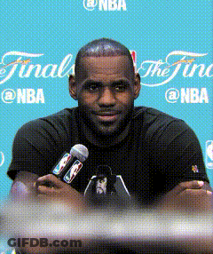 A Man Is Holding A Microphone In Front Of A Blue Background That Says Finals GIF
