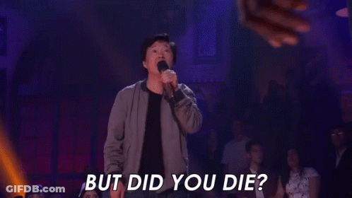 A Man Is Holding A Microphone In Front Of A Crowd And Says `` But Did You Die ? '' GIF