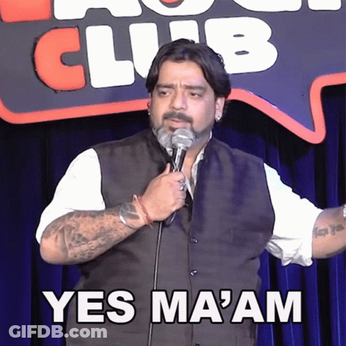 A Man Is Holding A Microphone In Front Of A Sign That Says Club GIF