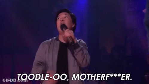 A Man Is Holding A Microphone On A Stage And Saying , `` Toodle-Oo , Motherf *** Er . '' GIF