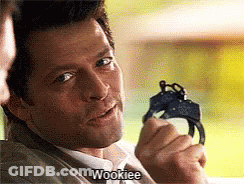 A Man Is Holding A Pair Of Handcuffs And Saying Wookiee GIF