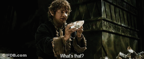 A Man Is Holding A Piece Of Crystal And Asking What 'S That GIF
