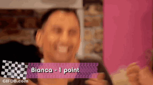 A Man Is Holding A Piece Of Paper That Says Bianca 1 Point GIF