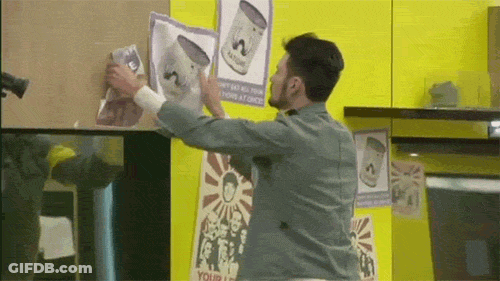 A Man Is Holding A Piece Of Paper That Says Your Life On It GIF