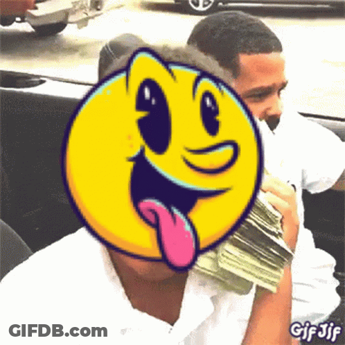 A Man Is Holding A Pile Of Money With A Pac Man Face Behind Him GIF